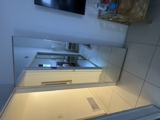 Large wall mirror in living space