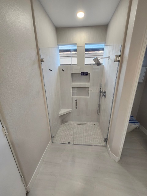 Custom frameless shower door installation