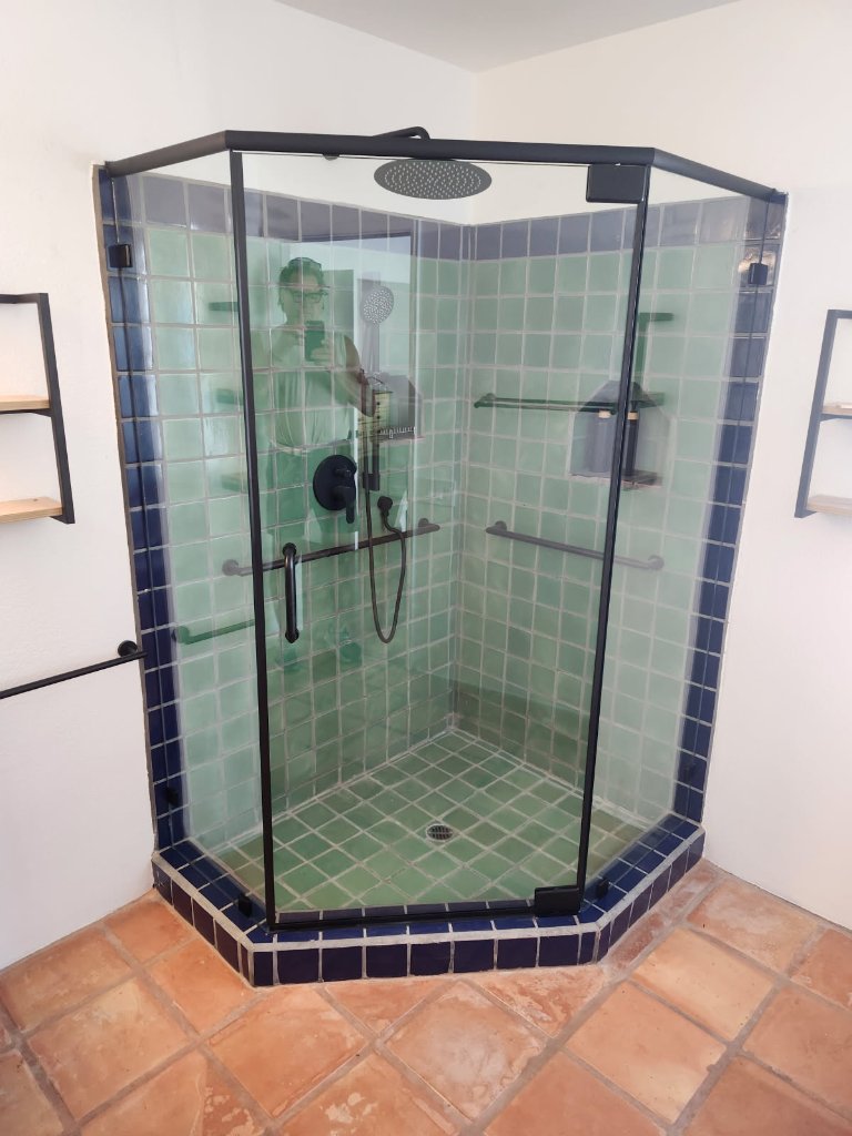 Hinged frameless glass shower door