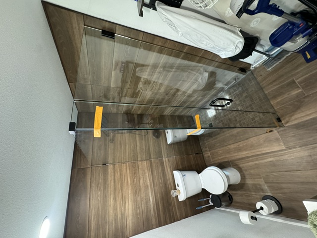 Luxury bathroom with corner frameless shower