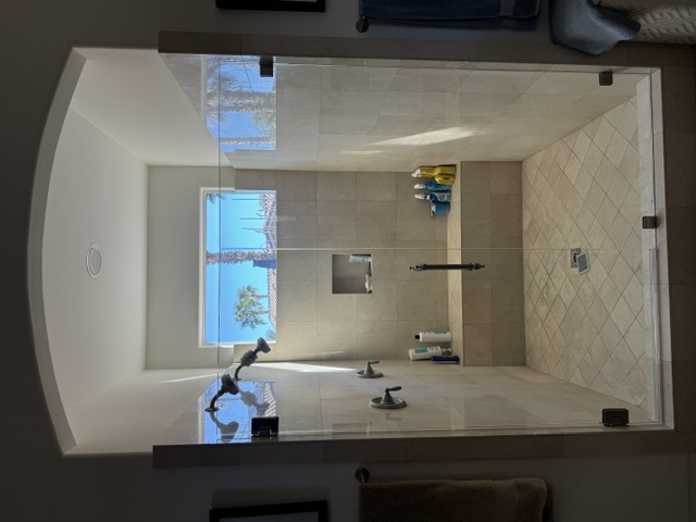 Frameless shower glass panel installation